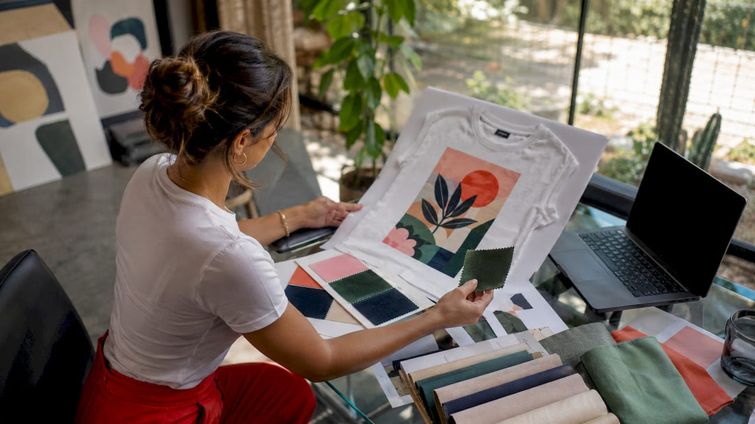 Designer examining band merch print samples