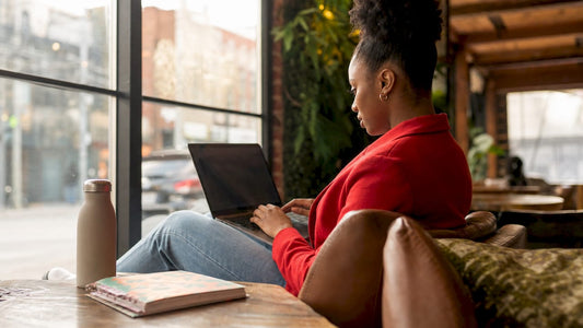 Woman using laptop on rooftop