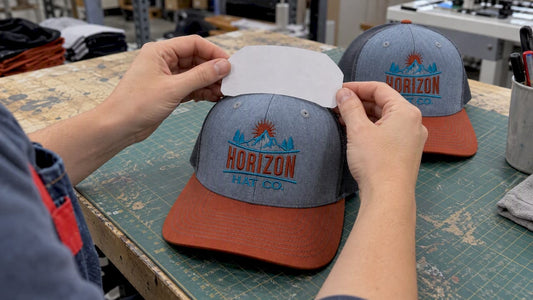 Paper template checked against a hat’s front panel