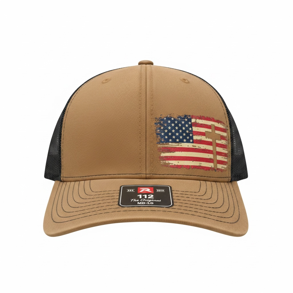 Tan and black Richardson 112 trucker hat featuring a distressed American flag with cross design on the front panel. Faith-based patriotic snapback cap decorated by HandmadeOhio.